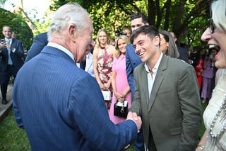 King Charles III meets Tom Daley during a garden party at British Embassy in Washington DC